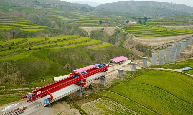 Workers join together girders of Mafanggou bridge of Yinchuan-Xi'an high-speed railway in NW China's Ningxia