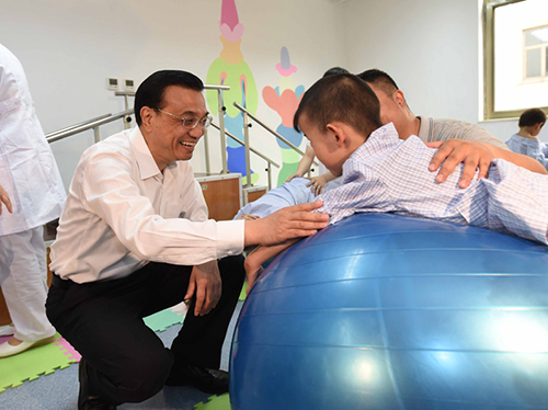 這三年，總理牽掛的殘疾人群體，迎來哪些暖政？