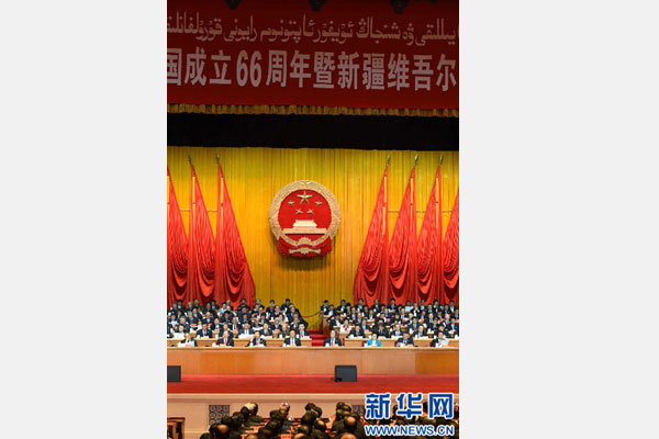 10月1日，慶祝中華人民共和國成立66周年暨新疆維吾爾自治區(qū)成立60周年大會在新疆人民會堂隆重舉行。 新華社記者 高潔 攝 